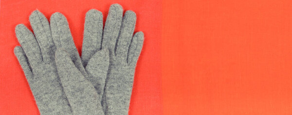 Womanly woolen gloves and shawl as clothes for autumn or winter, concept of warm apparel, place for text or inscription