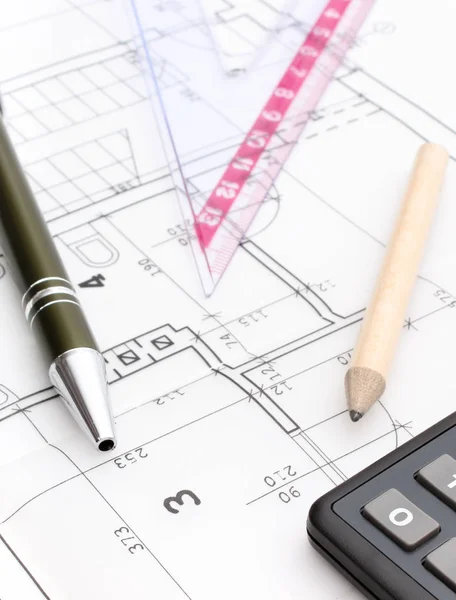 Drawing accessories and calculator on electrical construction drawing of house, building home cost concept
