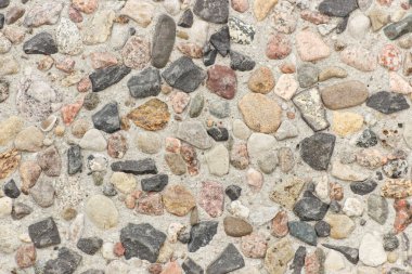 Arkaplan dokusu olarak çok sayıda küçük taş veya kaya
