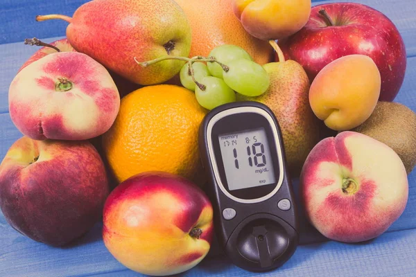 Glucose meter for checking sugar level and fresh healthy nutritious food as source natural vitamins and minerals, diabetes concept