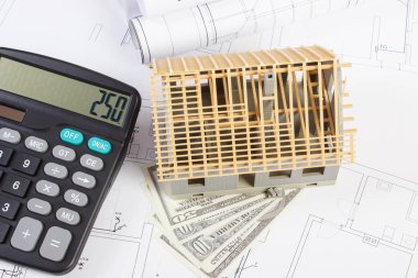 Oyuncak küçük ev inşaat, hesap makinesi ve para birimlerinin dolar elektrik çizimlerini ve diyagramlarını, ev maliyet bina kavramı altında