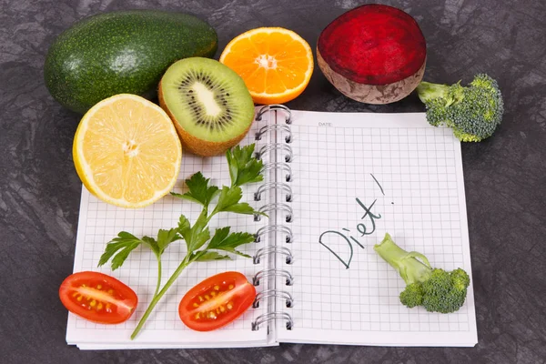 Word diet written in notepad and fresh ripe fruits with vegetables, healthy lifestyles and nutrition concept
