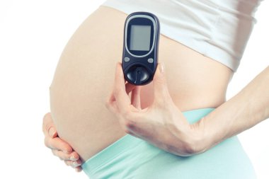 Glikoz metre ölçüm şeker seviyesi, Gebelikte diyabet kavramı tutan hamile kadın