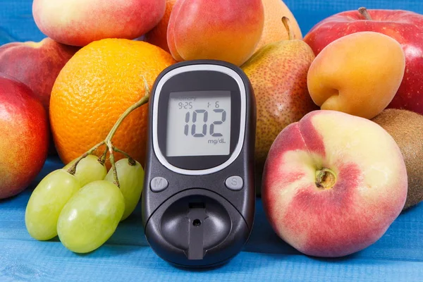 Glucose meter for checking sugar level and fresh healthy food as source natural vitamins and minerals, diabetes concept