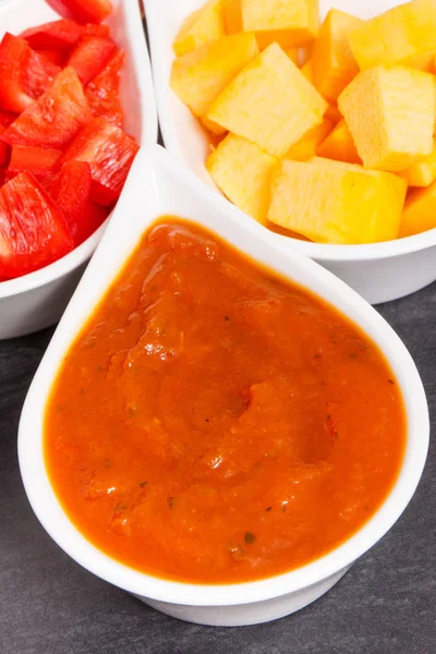 Homemade pumpkin sauce or ketchup with ingredients in bowls — Stock Photo, Image