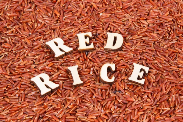 Heap of red rice as background, healthy gluten free food concept