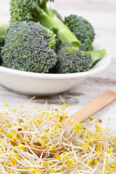 Broccoli sprouts and fresh vegetable as source natural vitamins and minerals. Healthy nutrition