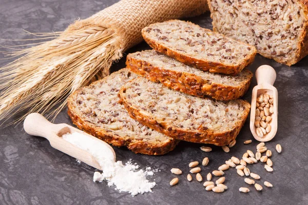 Bread for breakfast, ingredients for baking and ears of rye or wheat grain