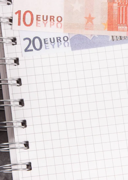 Notepad for notes and currencies euro. Place for text on sheet of paper — Stock Photo, Image