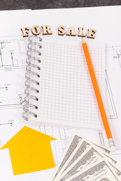 Inscription for sale, notepad and money on electrical diagrams, selling and buying house or flat concept — Stock Photo, Image