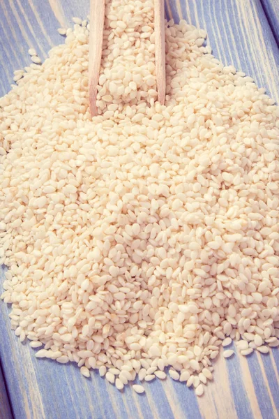 Vintage photo, Heap of sesame seeds on wooden boards — Stock Photo, Image