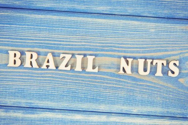 Vintage photo, Inscription brazil nuts on old boards