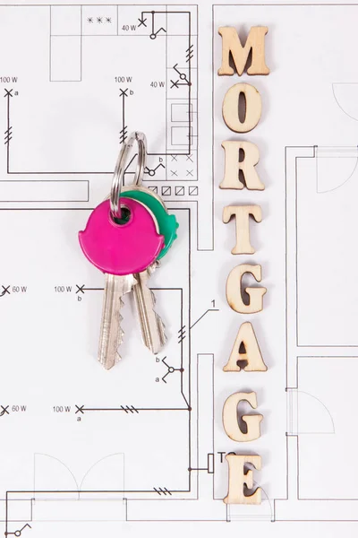 Hipoteca inscrição e chaves de casa em diagramas de construção de casa — Fotografia de Stock
