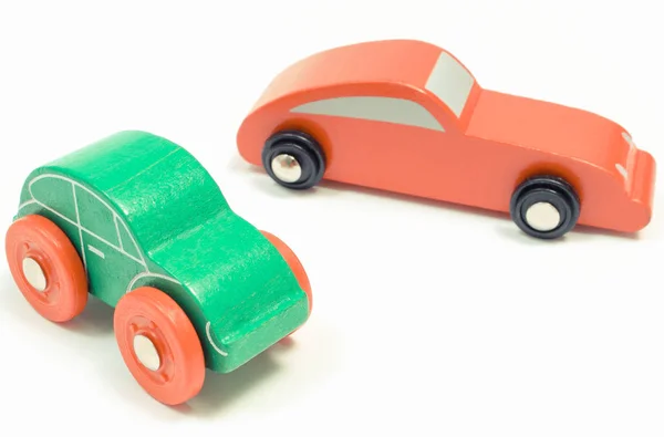 Green and red wooden toy cars on white background — Stock Photo, Image