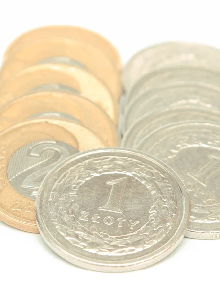 Coins lying on white background, polish currency — Stock Photo, Image