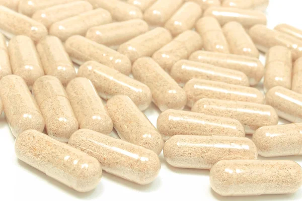Lek tabletki lub kapsułki na białym tle — Zdjęcie stockowe
