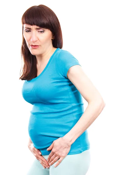 Θλιβερή δυστυχισμένη γυναίκα έγκυος με τα χέρια στο στομάχι της, εγκυμοσύνη υγείας και πόνους στην ουροδόχο κύστη — Φωτογραφία Αρχείου