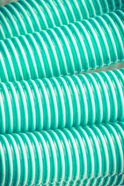 Plastic corrugated pipes as details of agricultural or industrial machinery, technology concept — Stock Photo, Image