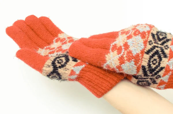 Hands of woman putting on woolen gloves — Stock Photo, Image