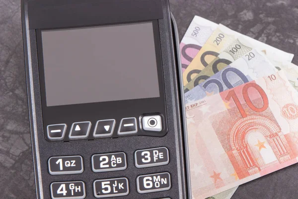 Payment terminal and currencies euro. Cashless or cash paying in different places — Stock Photo, Image