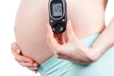 Glukometresi olan hamile bir kadın. Hamilelik konsepti sırasında şeker hastalığı