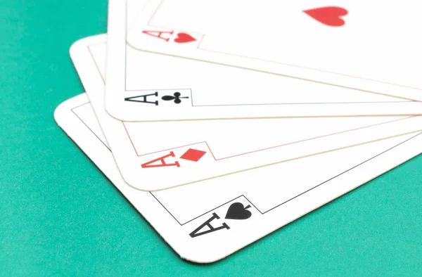 Four aces on green background. Gambling risk concept — Stock Photo, Image