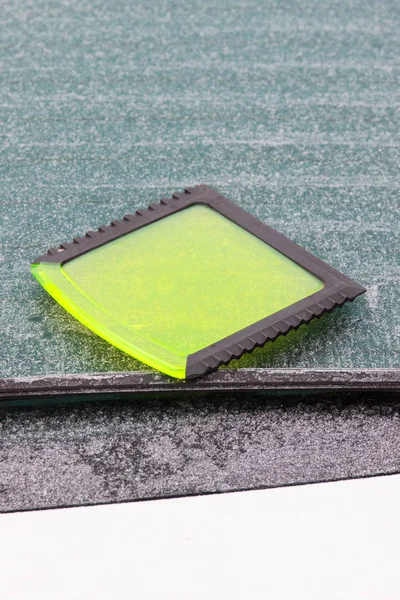 Scraper using to scrape ice from car window, winter problems in transportation concept — Stock Photo, Image