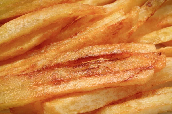 French fries fried in oil. Unhealthy and caloric nutrition concept
