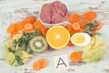 A vitamini, diyet lifleri ve doğal mineraller içeren farklı bileşenler, sağlıklı besleyici yeme kavramı