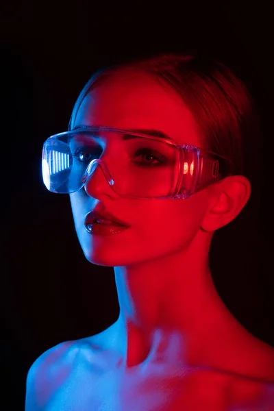 portrait of  girl in  disco style with blue and red light, girl in transparent big glasses with big eyes and smooth skin,