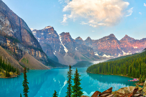 Sunrise over the Valley of the Ten Peaks with glacier-fed Moraine Lake in the foreground in the Canadian Rockies.