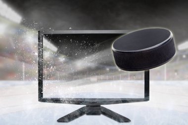 Hockey puck flying out of shattering TV screen in stadium with copy space. Concept of realistic 3D or 4D sports TV, virtual reality VR or computer gaming. clipart