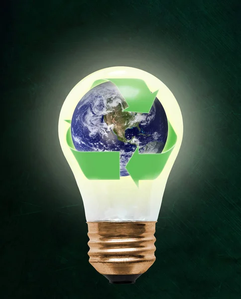 Planet earth wrapped in recycling symbol inside floating light bulb with copy space. Concept of ecology, environmental conservation; green alternative. Elements of this image provided by NASA.