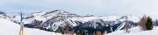 Panorama of Skiers on Chairlift Up a Ski Slope in the Canadian R — Stock Photo, Image