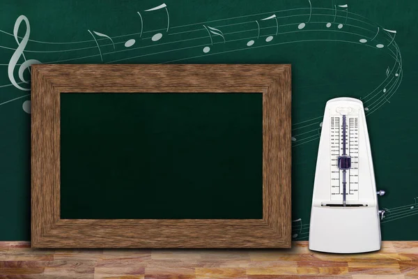 Music class concept with musical notes on background chalkboard and wooden frame copy space next to white mechanical metronome.