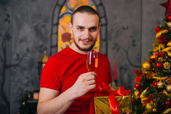 Man Beard Red Shirt Gift Hand Glass Champagne Festive Mood — Stock Photo, Image