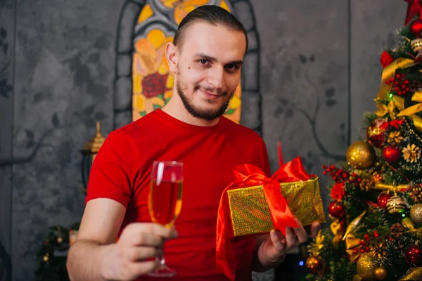 Man Beard Red Shirt Gift Hand Glass Champagne Festive Mood — Stock Photo, Image