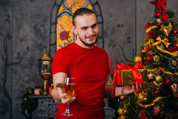 Man Beard Red Shirt Gift Hand Glass Champagne Festive Mood — Stock Photo, Image