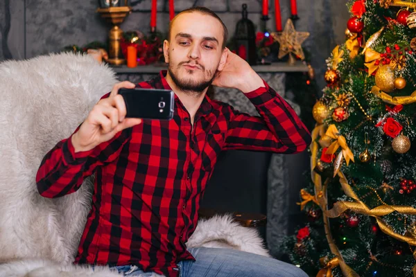 Young Guy Takes Selfie Smartphone Man Sitting Chair Communicating Using — Stock Photo, Image