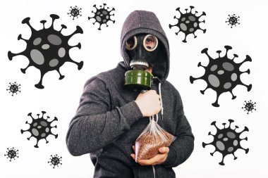 A guy in a gas mask and a gray hoodie is holding a packet of buckwheat. The stink in the toilet. Panic during quarantine.