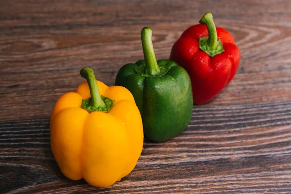 Sweet Pepper Multicolored Dark Wooden Background Red Yellow Green Peppers — Φωτογραφία Αρχείου