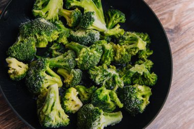 Frozen green cabbage, semi-finished product in a pan.
