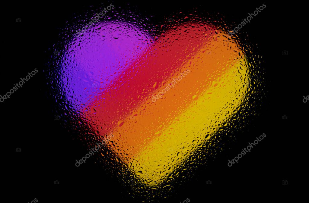 Heart with rainbow colors. Abstract photo with water drops on glass. Isolated on white background.
