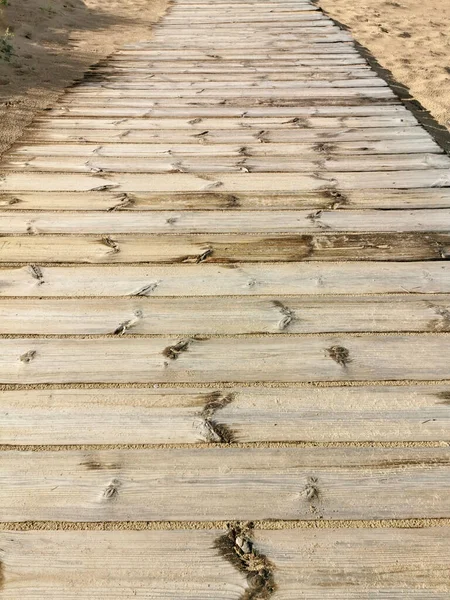 wooden planks for the road on the beach