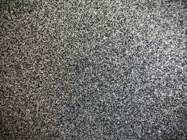 Arkaplanı parıldayan parlak gri kağıt.