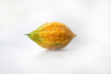 Close up of yellow bitter gourd with isolated background, the vegetables, a healthy diet and medicine.