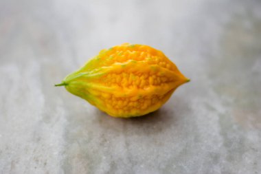 Close up of yellow bitter gourd with isolated background, the vegetables, a healthy diet and medicine.
