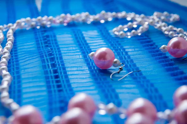 Pink Pearl Earrings Blue Ribbon — Stock Photo, Image