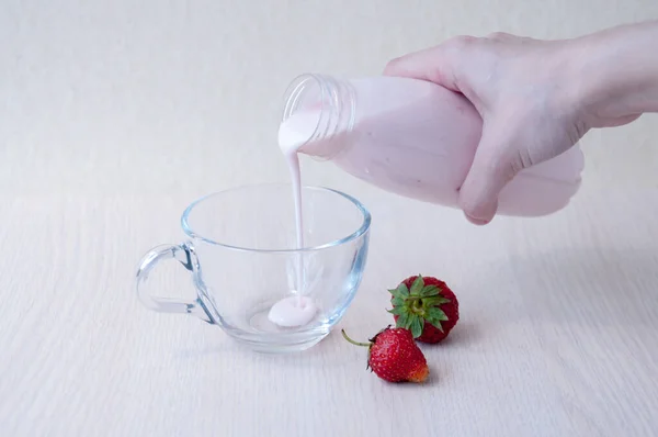 Red Strawberries Woman Hand Pours Yogurt Bottle Glass Mug Table — Stock Photo, Image