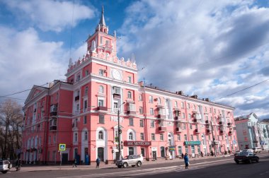 Russia, Komsomolsk-on-Amur, April 21:  a pink building with a spire clipart